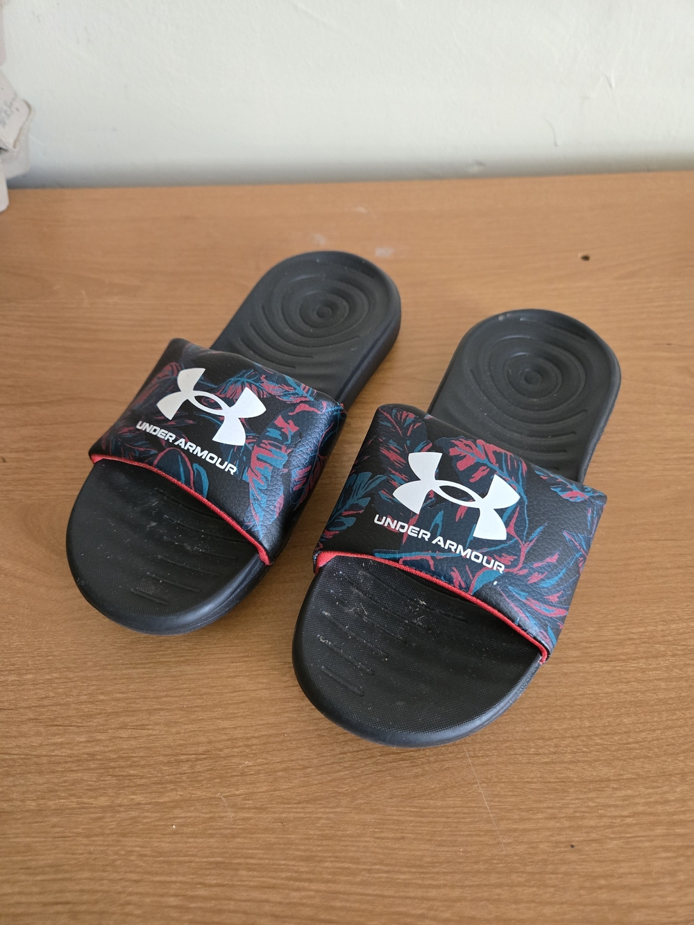 Under Armour Kids Black Slides with Tropical Leaf Print